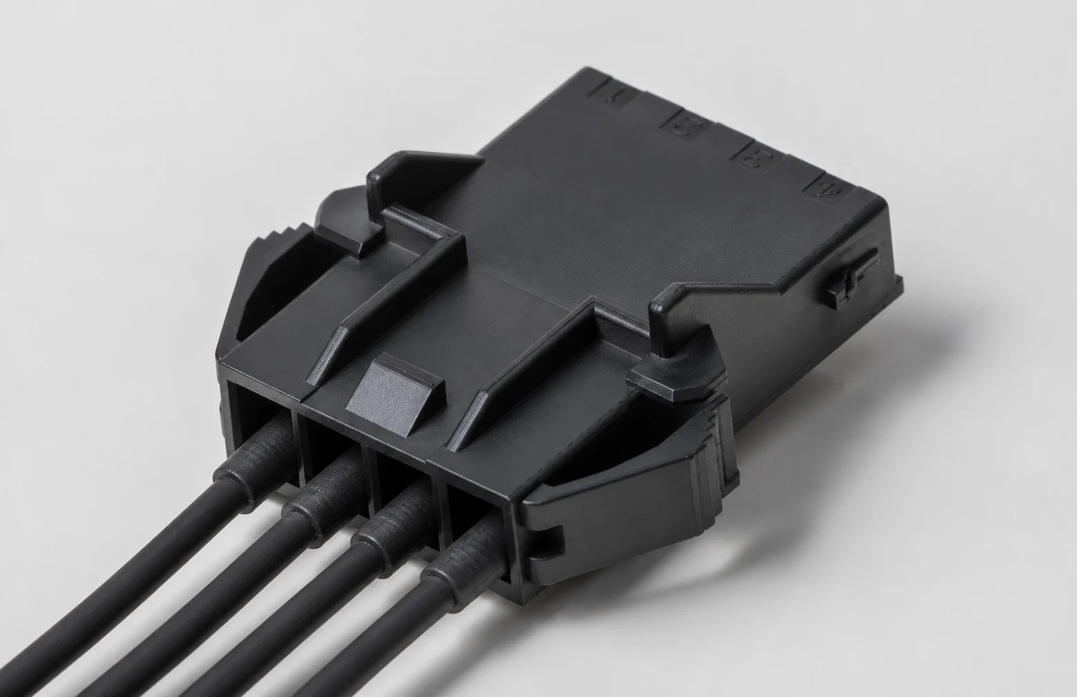 Sealed cable connector assembly examined for routing and support