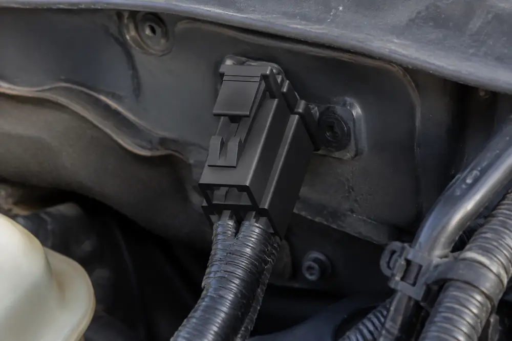 ZUCH automotive connector installed against a protected under-hood electronics mounting surface