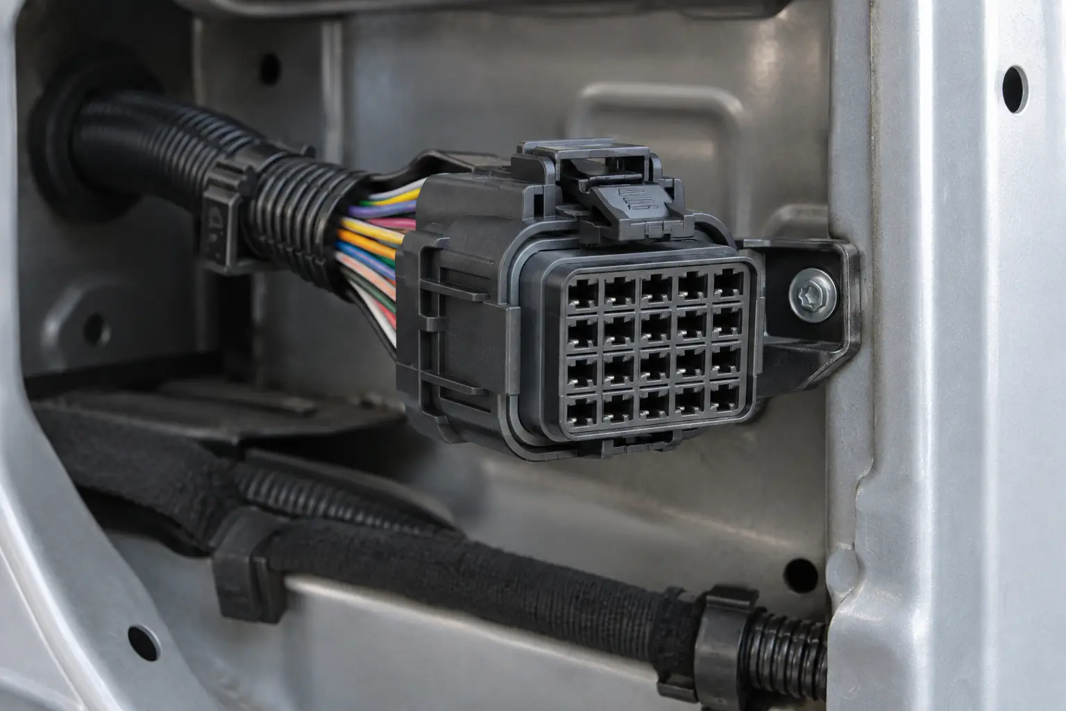 20-pin automotive connector shown with multi-circuit harness routing and service clearance